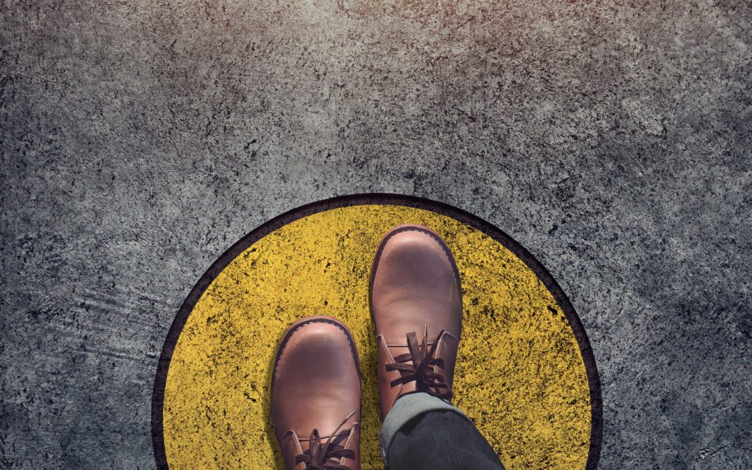 feet stepping on yellow circle